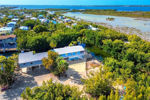 birds eye view of property with a water view and a residential view