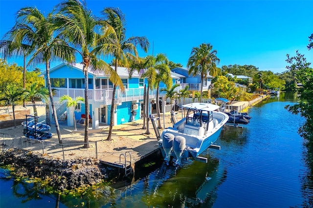 dock area featuring a water view and boat lift