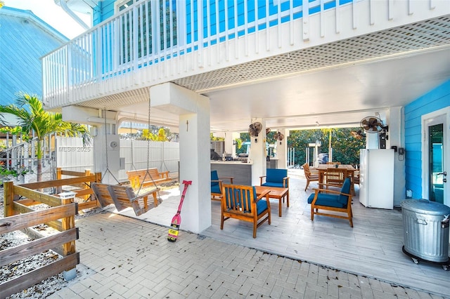 view of patio / terrace featuring fence and outdoor lounge area