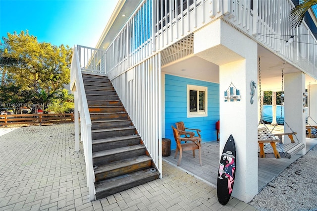 entrance to property featuring fence