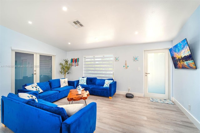 living room with french doors, light wood finished floors, recessed lighting, visible vents, and baseboards