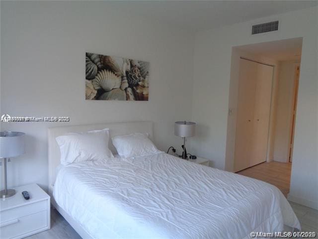 bedroom featuring visible vents