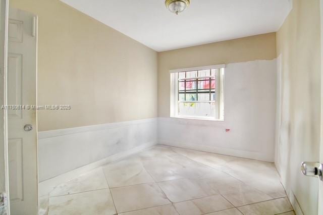 empty room featuring tile patterned flooring