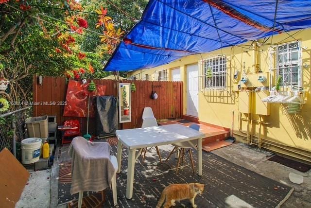 view of patio featuring fence