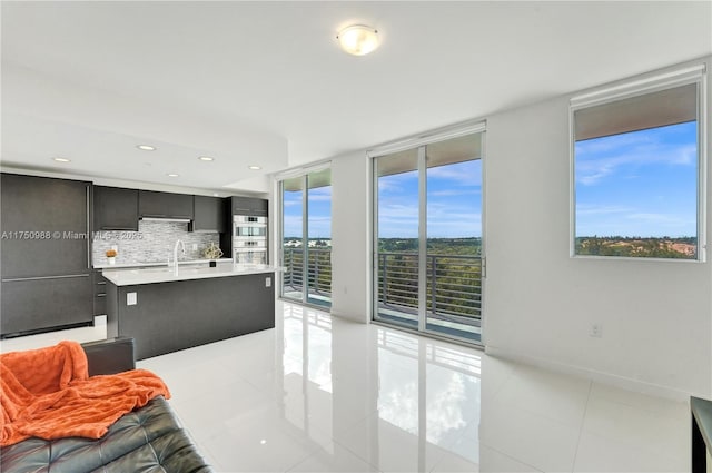 7875 NW 107th Ave Unit 518, Doral, FL 33178 - living area featuring light tile patterned floors, baseboards, recessed lighting, and floor to ceiling windows
