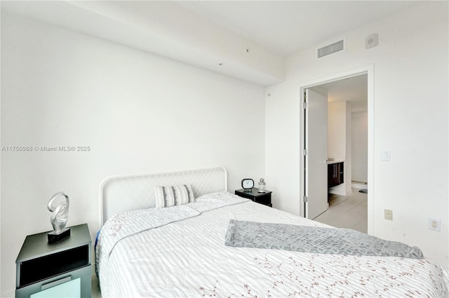 bedroom featuring visible vents and light tile patterned flooring