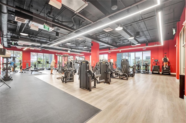 gym with wood finished floors