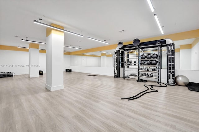 7875 NW 107th Ave Unit 518, Doral, FL 33178 - gym featuring baseboards and wood finished floors