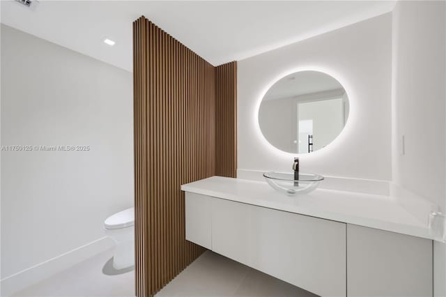 5500 Collins Ave Unit 802, Miami Beach, FL 33140 - half bathroom featuring vanity and toilet