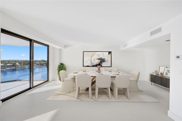 5500 Collins Ave Unit 802, Miami Beach, FL 33140 - dining area featuring visible vents and a water view