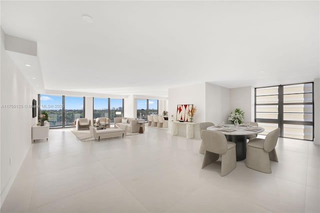 5500 Collins Ave Unit 802, Miami Beach, FL 33140 - tiled dining space featuring a wall of windows