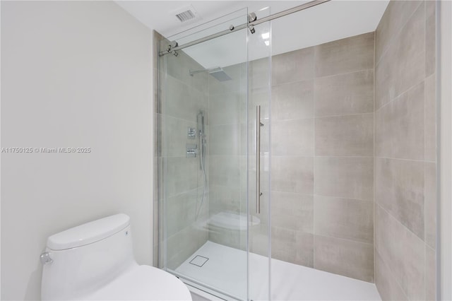 5500 Collins Ave Unit 802, Miami Beach, FL 33140 - full bathroom featuring a stall shower, toilet, and visible vents