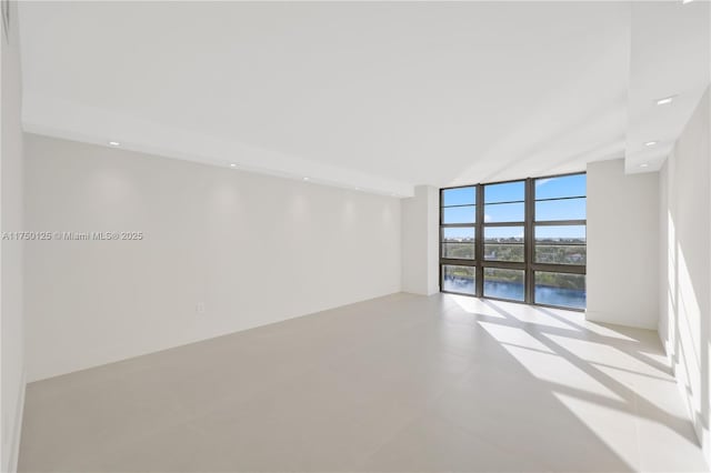 5500 Collins Ave Unit 802, Miami Beach, FL 33140 - spare room featuring floor to ceiling windows