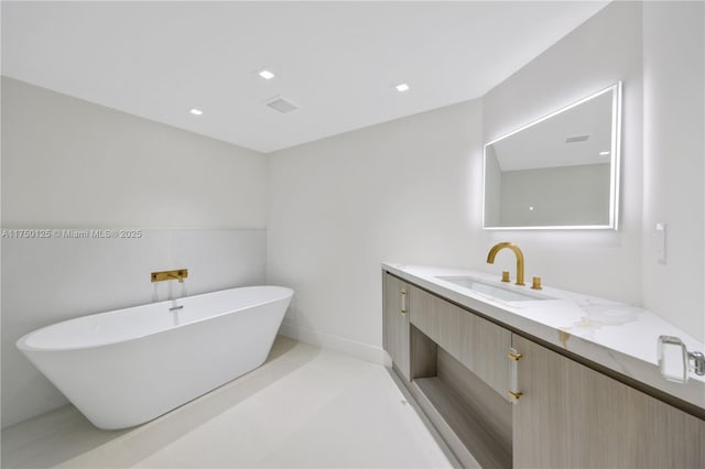 5500 Collins Ave Unit 802, Miami Beach, FL 33140 - bathroom with vanity, recessed lighting, a freestanding tub, and visible vents