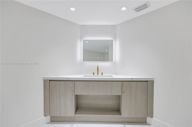 5500 Collins Ave Unit 802, Miami Beach, FL 33140 - bathroom with baseboards, visible vents, and vanity