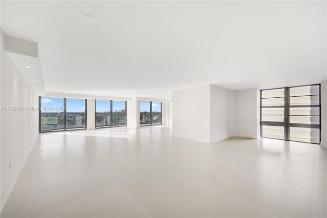5500 Collins Ave Unit 802, Miami Beach, FL 33140 - spare room with floor to ceiling windows