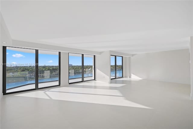 5500 Collins Ave Unit 802, Miami Beach, FL 33140 - empty room featuring tile patterned flooring and a water view