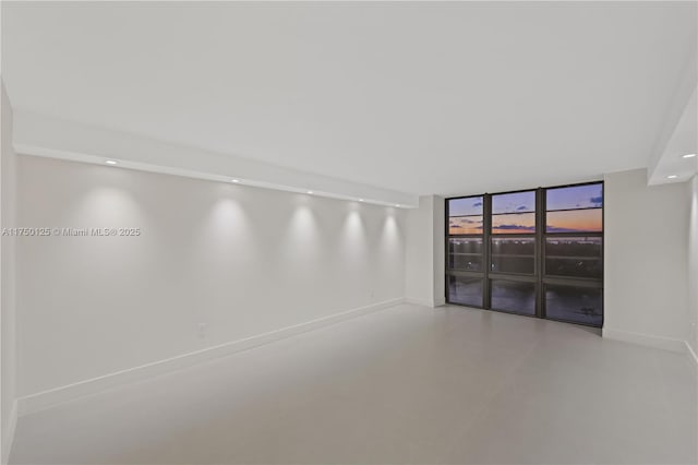 5500 Collins Ave Unit 802, Miami Beach, FL 33140 - spare room with finished concrete floors, recessed lighting, and baseboards