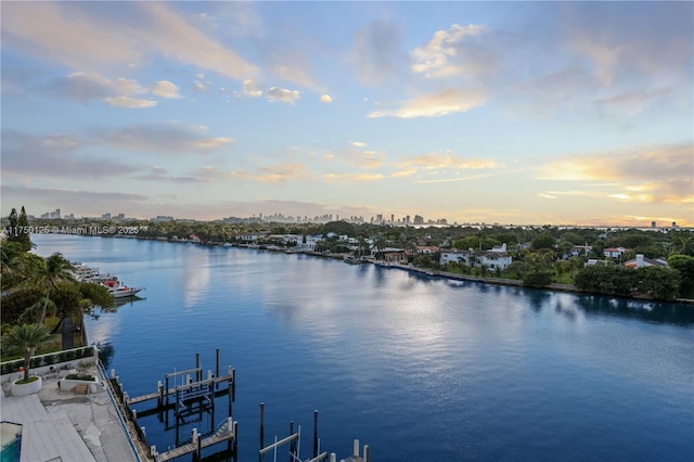 5500 Collins Ave Unit 802, Miami Beach, FL 33140 - property view of water featuring boat lift and a dock