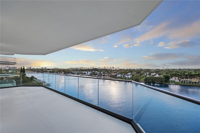 5500 Collins Ave Unit 802, Miami Beach, FL 33140 - balcony at dusk with a water view