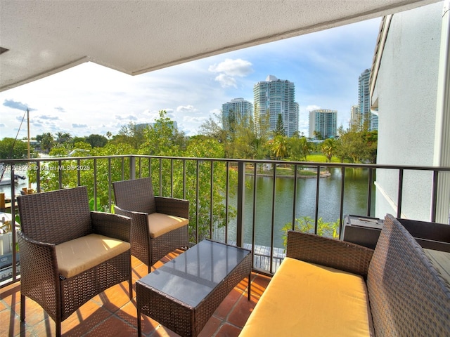 balcony with a view of city and a water view