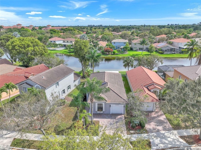 birds eye view of property featuring a water view and a residential view