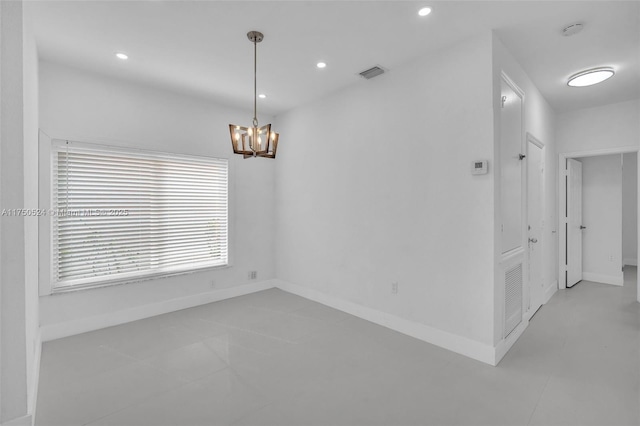 spare room featuring baseboards, visible vents, a notable chandelier, and recessed lighting