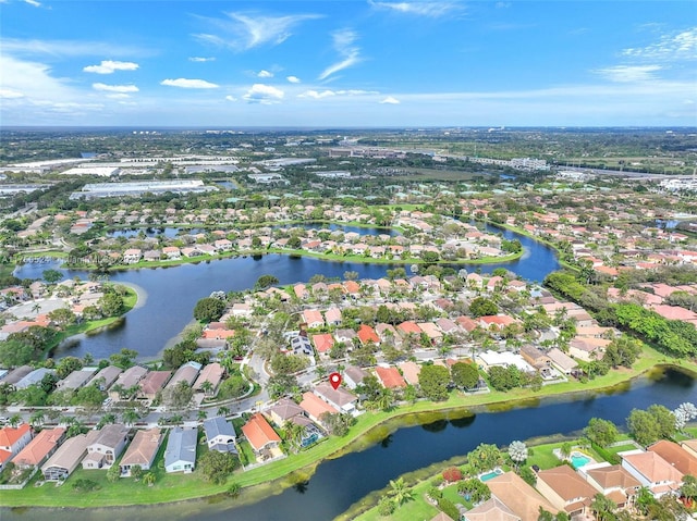 birds eye view of property featuring a water view and a residential view