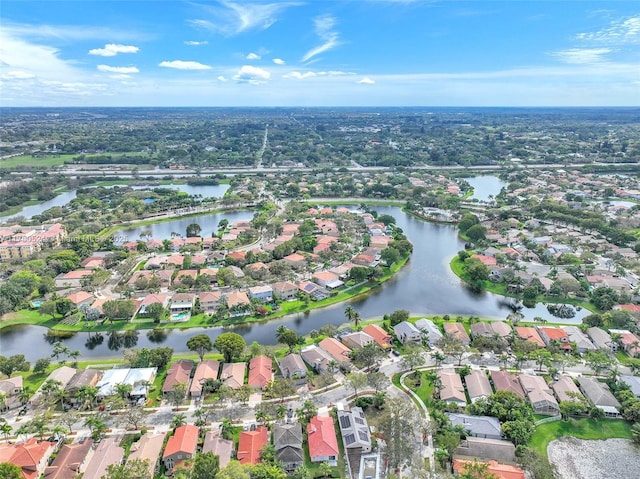 drone / aerial view featuring a water view and a residential view