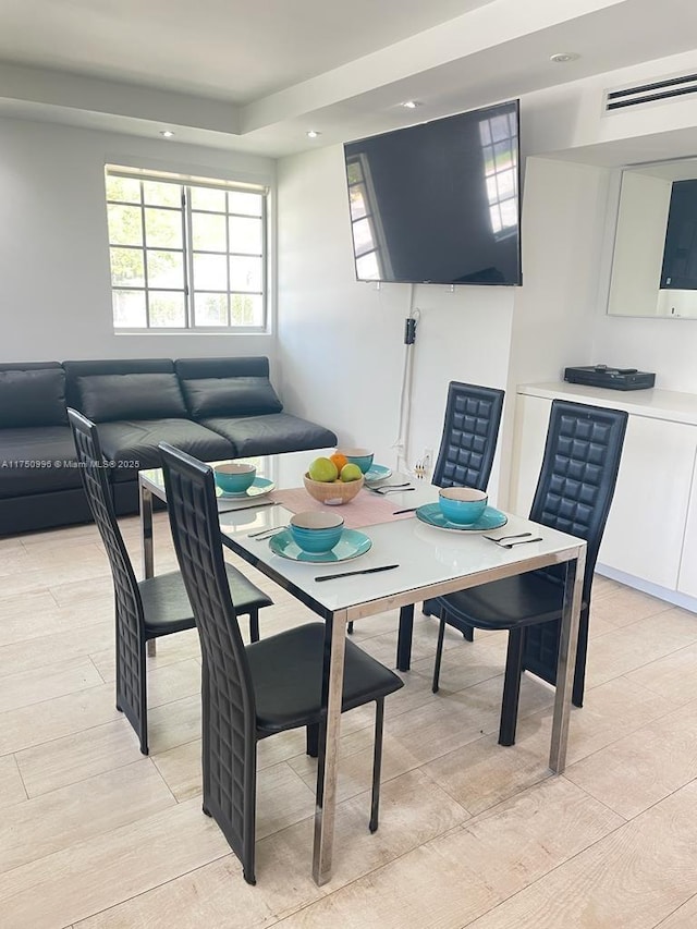 dining space featuring visible vents