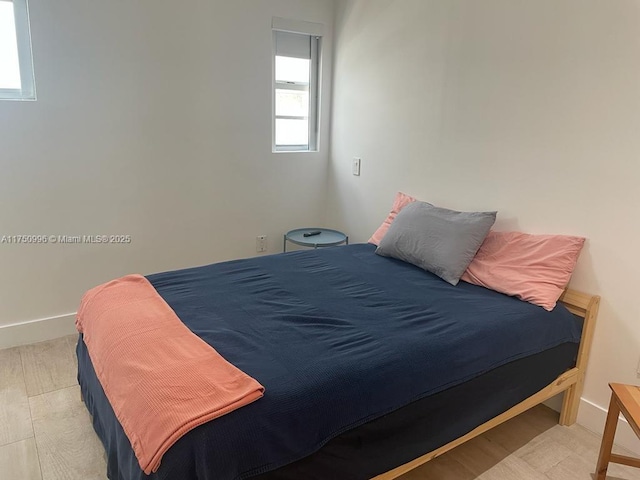 bedroom featuring baseboards