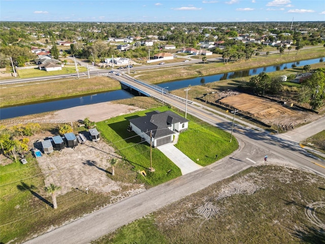 bird's eye view with a residential view and a water view