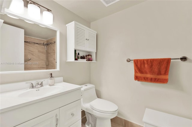 bathroom featuring visible vents, vanity, walk in shower, and toilet