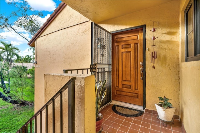 doorway to property with stucco siding