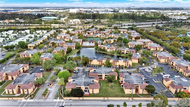 bird's eye view with a water view and a residential view