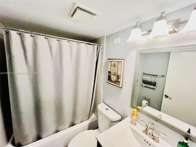 bathroom featuring shower / tub combo, visible vents, vanity, and toilet