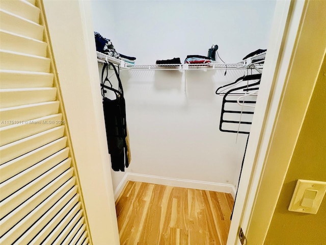 walk in closet featuring wood finished floors