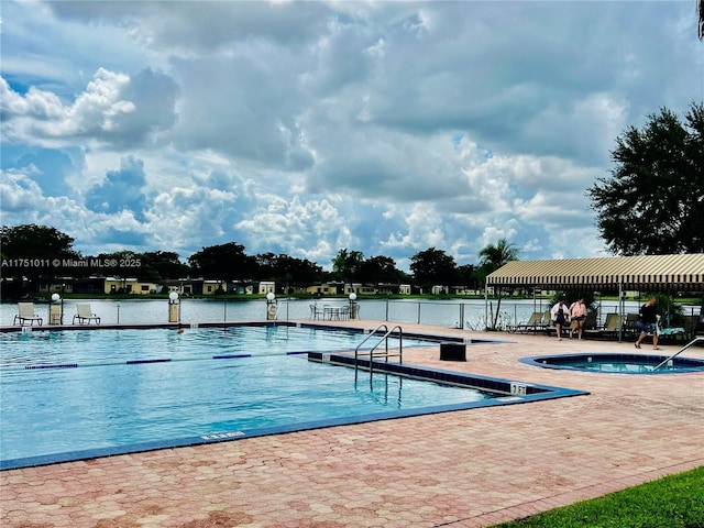 community pool with a patio area