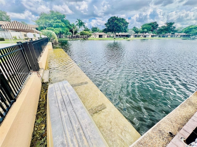 view of water feature with fence