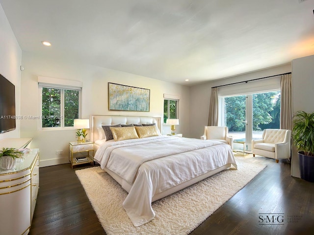 bedroom with access to outside, dark wood-style flooring, baseboards, and recessed lighting