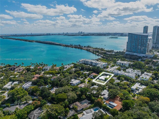 drone / aerial view featuring a water view and a city view