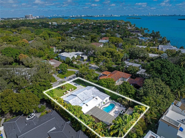 birds eye view of property featuring a water view and a residential view