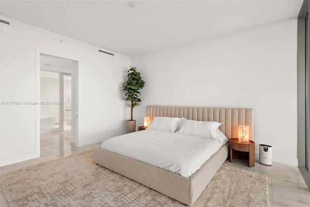 bedroom featuring light tile patterned flooring and visible vents