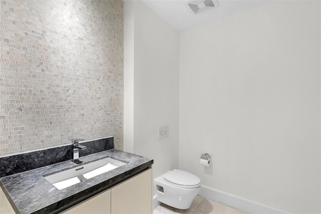 half bathroom with visible vents, baseboards, toilet, tile patterned flooring, and vanity