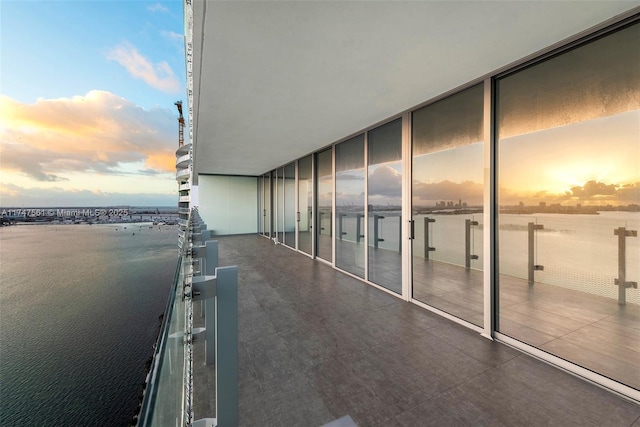 balcony at dusk with a water view