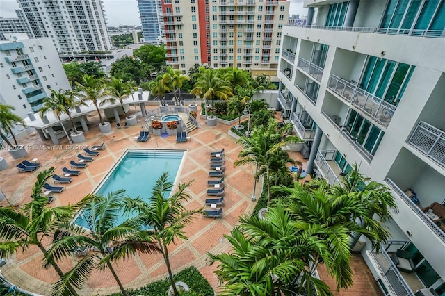 community pool featuring a city view and a patio