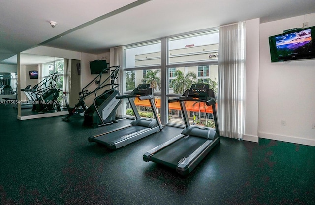 workout area featuring baseboards