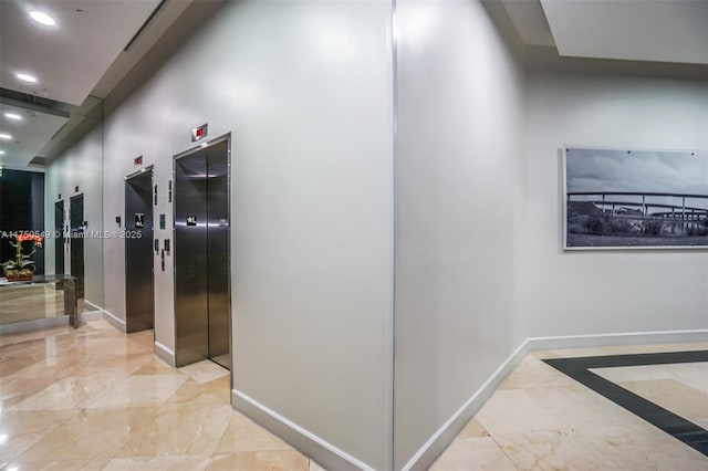 corridor featuring recessed lighting, elevator, marble finish floor, and baseboards