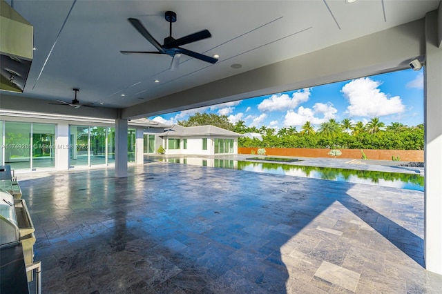 view of swimming pool with a fenced in pool, fence, a ceiling fan, and a patio area