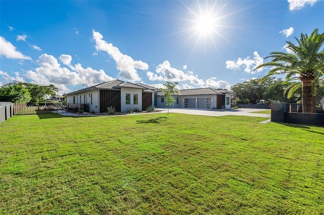 exterior space featuring a garage and fence